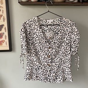 Slight peplum button down top